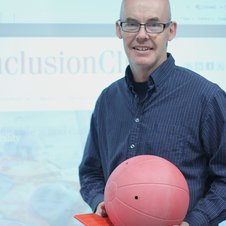 Picture of peter holding a goalball ball